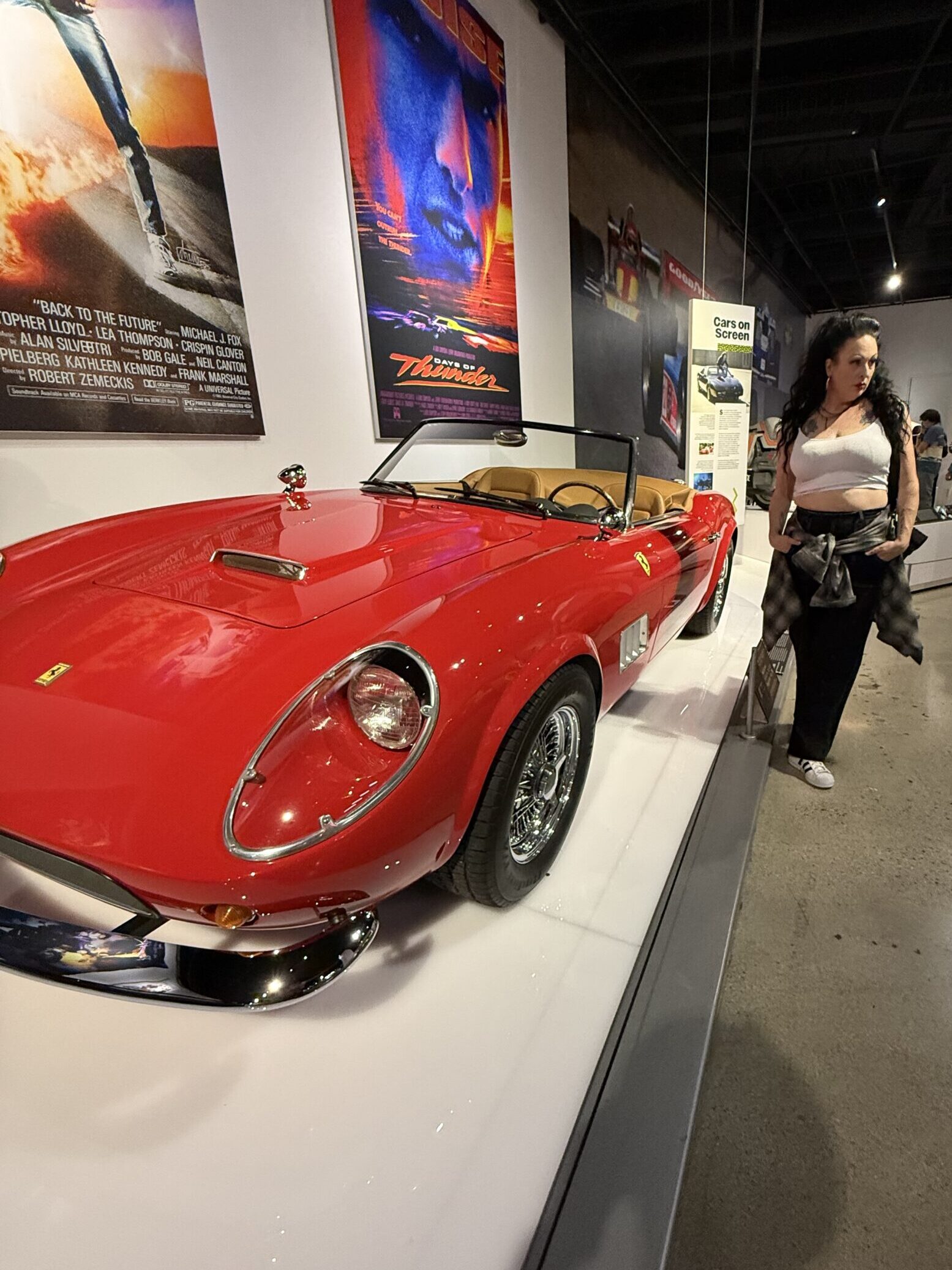 Regina Luz Jordan founder of the Hollywoodland News with the 1961 Ferrari 250 GT California Spyder Prototype Model that was used in Paramount Pictures' Ferris Beuller's Day Off 1986. This car is on exhibit at the Totally Awesome Exhibit at the Petersen Automotive Museum. Photograph by Mark Jordan for Hollywoodland News