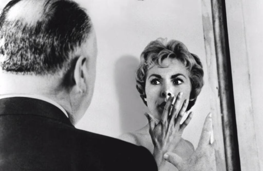 Alfred Hitchcock with Janet Leigh on the set of Psycho. (Credit: Sunset Boulevard/Corbis/Getty Images)