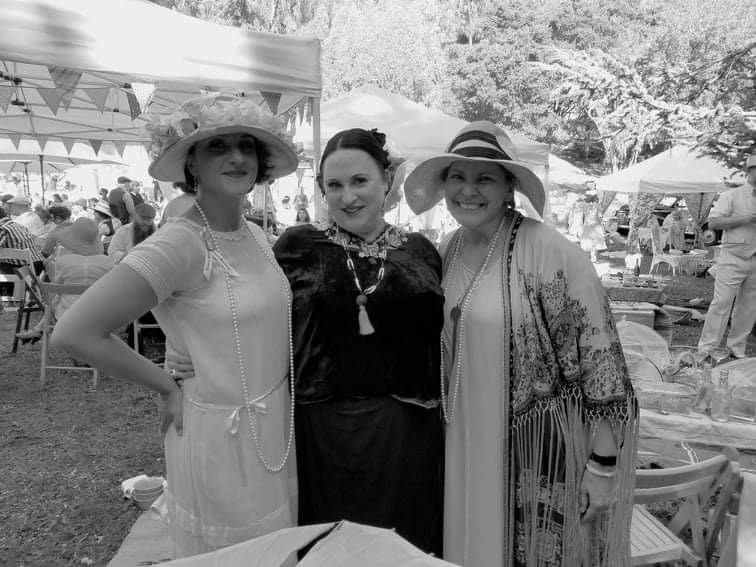 Regina Luz Jordan with Diana Brito, chair of the Gatsby Picnic and Interim president of the Art Deco Society of California, Serafina Miller