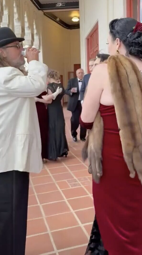 Regina Luz Jordan with Marisa Firebaugh confronting the couple we dressed in racist caricatures at the art deco society of california's 2025 preservation ball.
