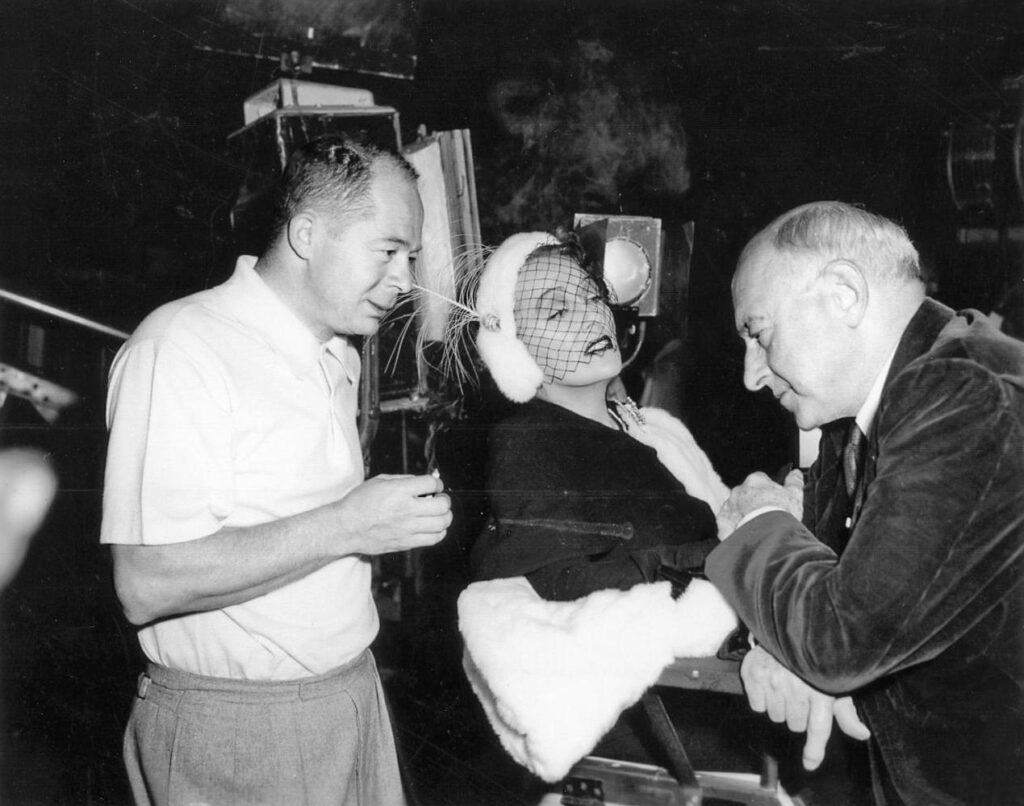 Director Billy Wilder, rebel filmmaker who defied Hollywood norms on the sunset boulevard anniversary included in this photo is Gloria Swanson with writing partner Charles Brackett